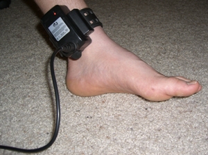 GPS tracking device on ankle of 13-year-old boy